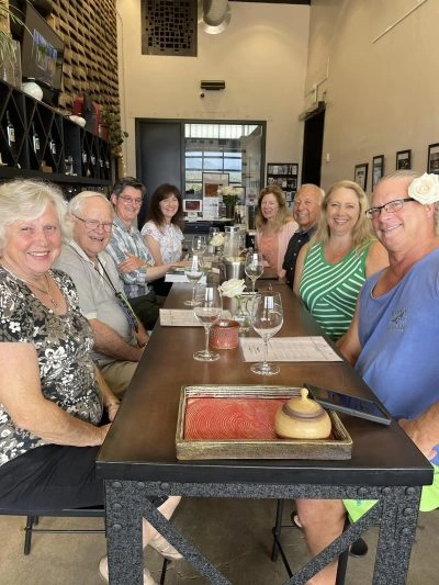 Group enjoying a guided wine tasting experience at the winery